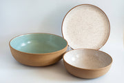 RachaelPots - Serving Platter: Sage features a speckled brown exterior, smooth turquoise interior, and complements matching bowls and plates, ideal for showcasing culinary creations.