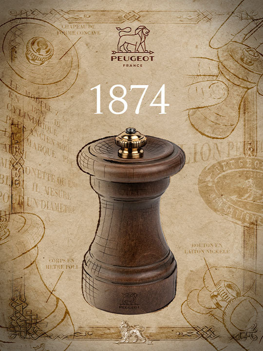 Peugeot | 1874 Manual Wooden Salt Mill, 4-inch, featuring a vintage-inspired design with a patinated beechwood body and brass adjustment knob, celebrating Peugeot's craftsmanship heritage.