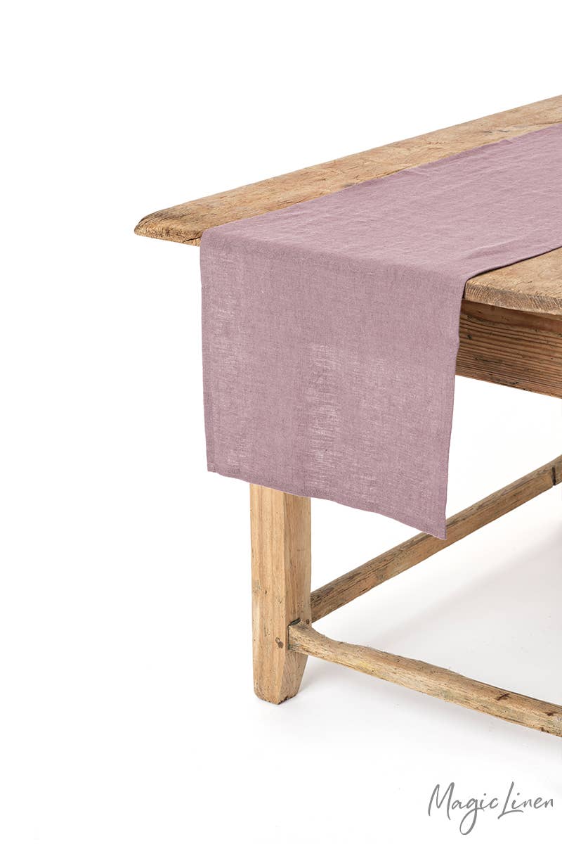 MagicLinen - Linen table runner displayed on a wooden table, showcasing its texture and versatility for kitchen decor, available in various sizes and styles.