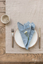 Set of 2 linen napkins arranged with a flower, highlighting their elegant design for table decor, ideal for enhancing dining experiences.