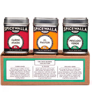 Spicewalla | Street Taco Spice Gift Set: A trio of metal tins featuring Carne Asada, Al Pastor, and Pescado Verde taco seasoning blends on a The Taco Blends Collection box.