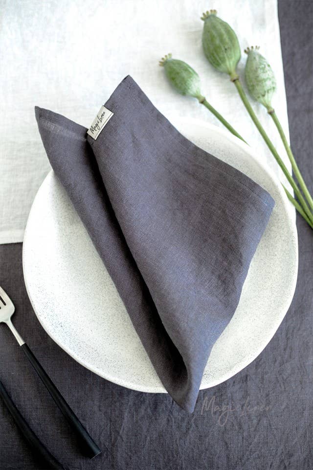 Set of 2 MagicLinen napkins on a plate, showcasing premium, stone-washed linen for versatile table decor. Ideal for sustainable, stylish table settings.