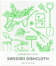 Bespoke Provisions - Gardening Swedish Dishcloth features a green line drawing of a wheelbarrow and gardening tools, ideal for eco-friendly cleaning tasks.