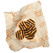 Bee's Wrap - Lunch 3 Pack - Honeycomb Print, featuring reusable wraps for sandwiches and snacks, displayed on a wrapper with cookies visible, ideal for sustainable food storage.