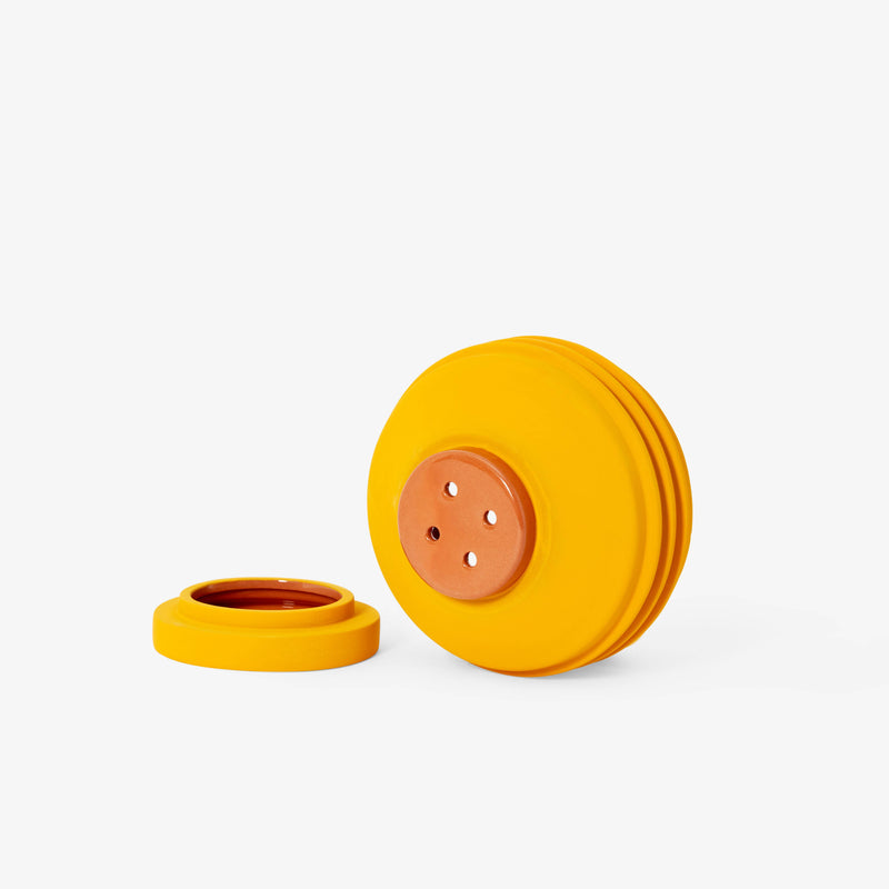 Areaware - Strata Plant Vessel: Yellow, a ceramic planter with layered shapes, concealing its saucer, inspired by Simone Brewster's sculptural design heritage.
