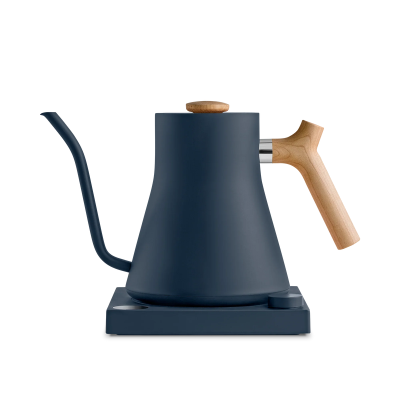 Fellow | Stagg EKG Electric Kettle with matte navy body and wood accents, on base. Ideal for precision pour-over coffee or tea brewing.