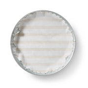 Sandy Stripes Original Flat Plate Liners displayed on a metal tray, highlighting the oval design, ideal for enhancing dining presentation.