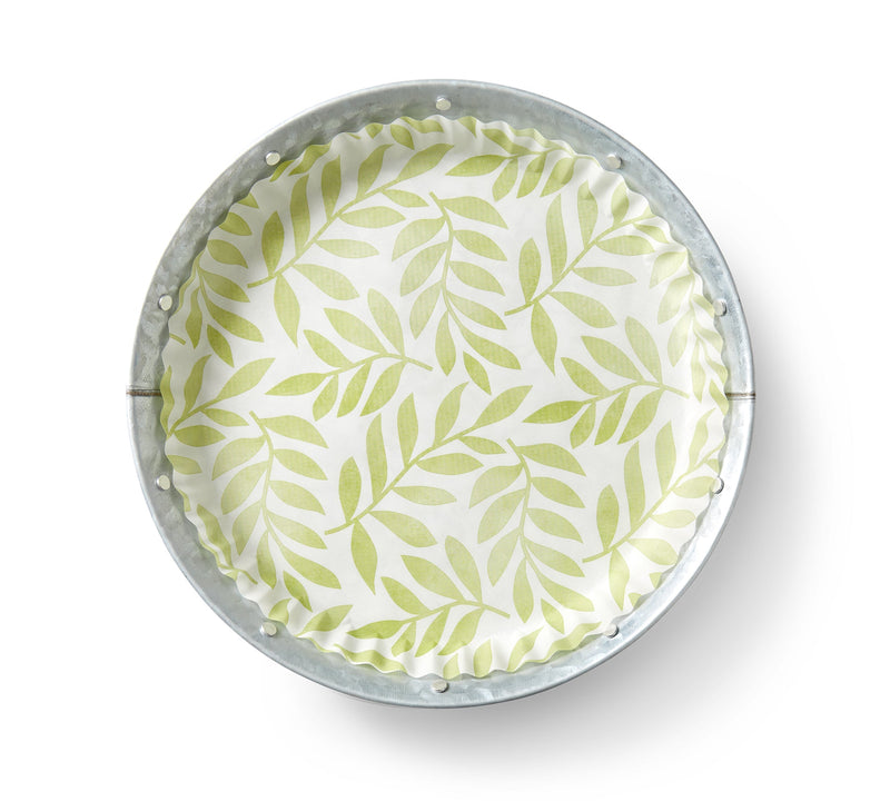 Round porcelain plate with intricate leaf pattern, part of 'Mom's Garden' Pre-Formed Plate Liners collection, ideal for elegant serving.