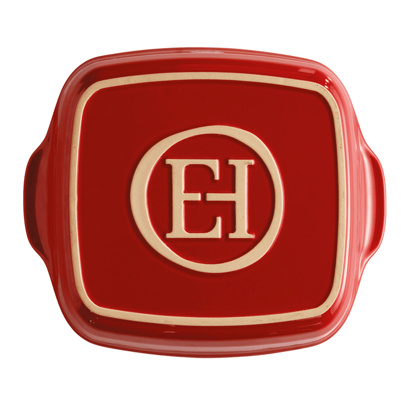 Emile Henry | Square Bakers, Burgundy: Red ceramic baking dish with side handles, embossed with EH monogram, ideal for versatile oven-to-table use, crafted from heat-retaining Burgundian clay.