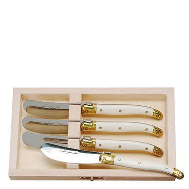 The French Farm - Jean Dubost 4 Spreaders with Ivory handles in Wood Box, featuring stainless blades and brass accents, perfect for serving soft cheeses elegantly.
