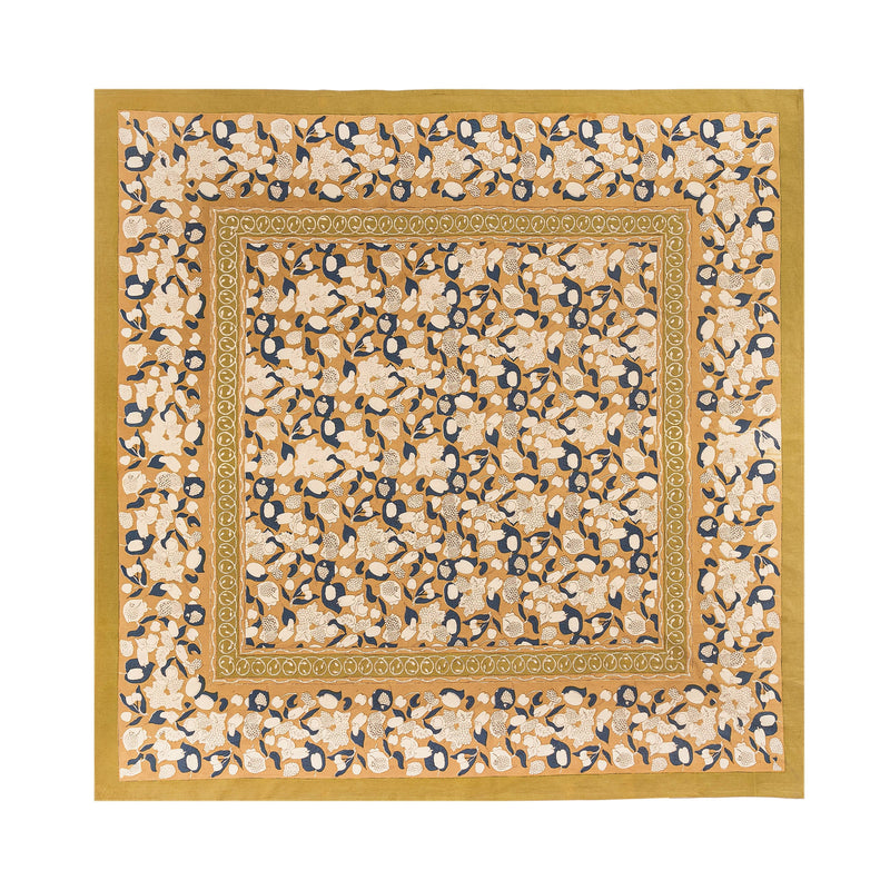 Couleur Nature - Forest Harvest Mustard & Blue tablecloth, featuring a hand-printed floral pattern with navy and cream leaves, framed by decorative borders.