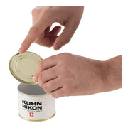 Hands opening Kuhn Rikon LidLifter can, showcasing its safe, self-attaching design for mess-free use. Featured by Athens Cooks kitchen store.