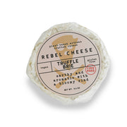 Rebel Cheese - Cave-Aged Truffle Brie Plant Based - 5.4 oz, featuring a round, white form with a detailed label.