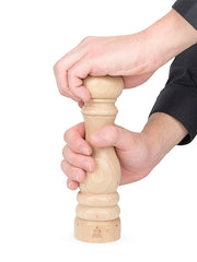 Peugeot | Paris u'Select Natural Wood Salt Mill, 9 inches, being used with two hands to grind salt, showcasing its elegant, slender design.