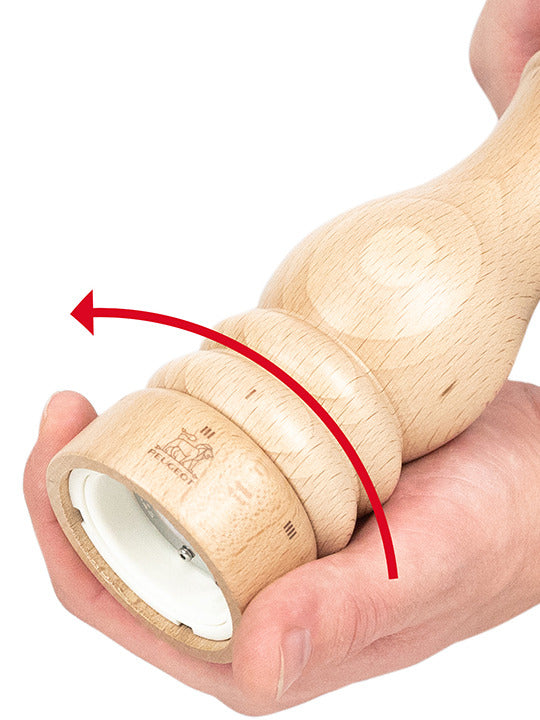 Peugeot | Paris u'Select Natural Wood Salt Mill, 9 inches, in hand demonstrating twisting motion, highlighting precision grinding with adjustable settings for custom salt texture.