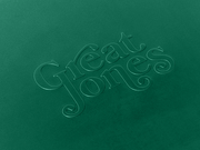 Great Jones | Little Sheet - Pepper, a quarter-sized nonstick sheet pan, ideal for small bakes or reheating, displayed with elegant calligraphy details.
