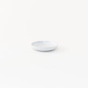 Sarah Kersten - Olive Dish: Basin Collection: Classic White, a small, elegant, versatile plate perfect for olives or bread, on a white surface.