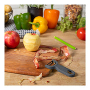 Kuhn Rikon | Original Swiss Peeler - Grey displayed on a wooden cutting board with a peeled apple, showcasing its efficient design and razor-sharp performance.