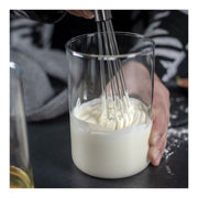 Whisking creamy mixture with Kuhn Rikon | ESSENTIAL Ball Whisk, highlighting its innovative design for efficient mixing in Athens Cooks' curated kitchen collection.