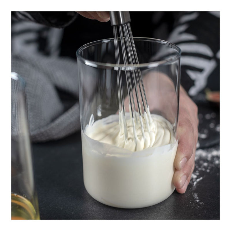 Whisking creamy mixture with Kuhn Rikon | ESSENTIAL Ball Whisk, highlighting its innovative design for efficient mixing in Athens Cooks' curated kitchen collection.