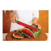 Kuhn Rikon | Original Melon Knife slicing through watermelon on a wooden board, showcasing its serrated blade and ergonomic handle for effortless cutting.