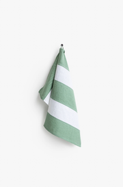 MagicLinen - Striped Linen Tea Towel in Olive Green, hanging on a hook. Part of a zero-waste program, designed with a loop for easy kitchen access.