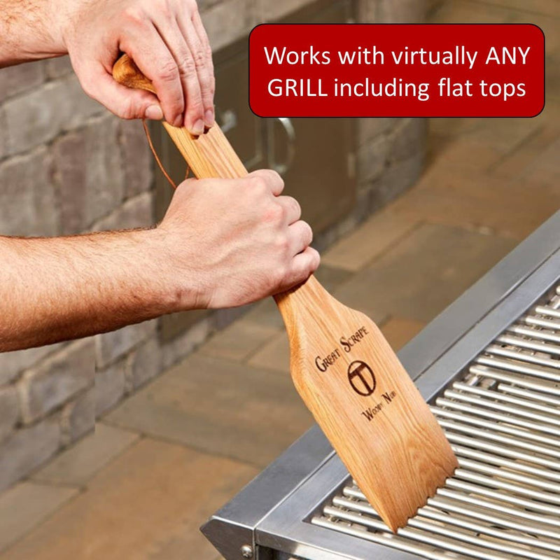 Great Scrape - Woody Nub in use, a paddle-shaped wooden grill scraper with a serrated edge, ideal for bristle-free cleaning of stainless-steel grill grates.
