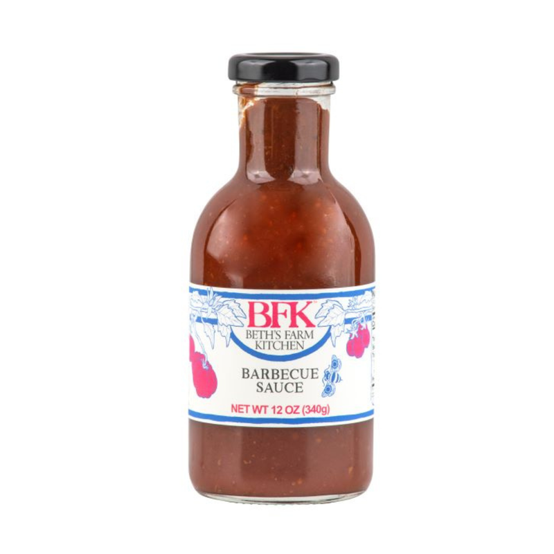 Beth's Farm Kitchen BBQ Sauce, 12 oz bottle, rich apple-smoky flavor. Perfect for elevating dishes. Vegan, gluten-free, no artificial ingredients. Ideal for grilling.