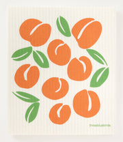 Swedish dishcloth featuring orange fruits and green leaves design, perfect for reducing waste in the kitchen; absorbs 20x its weight.