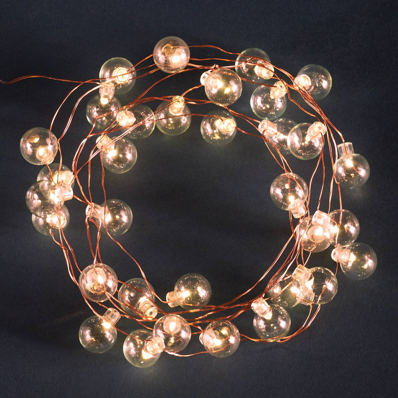 Napa Home & Garden - Napa Night Sky LED Mini Globe Lights, 24.6' Battery Operated, showcasing warm white bulbs ideal for outdoor evening decor and events.