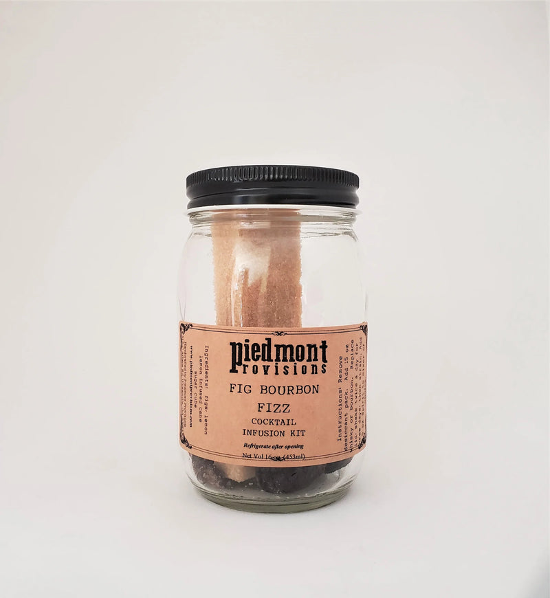 Piedmont Provisions Fig Bourbon Fizz Cocktail Infusion Kit in a mason jar, featuring dried figs, orange peels, and spices for creating a unique bourbon cocktail.