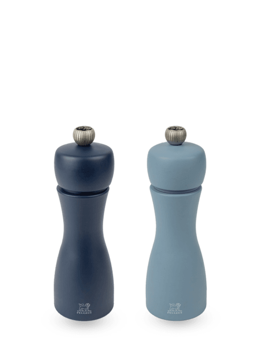 Peugeot | Tahiti Duo Salt + Pepper Mills - Air, curvy hourglass-shaped mills with S and P adjustment knobs, crafted from sustainably sourced wood.