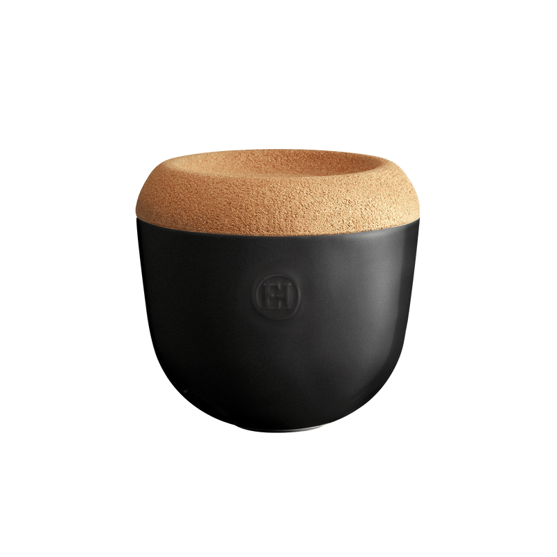 Emile Henry Garlic Pot, a matte-black and cork container, ideal for keeping garlic fresh. Celebrates French craftsmanship and elegance, fitting seamlessly into any modern kitchen.
