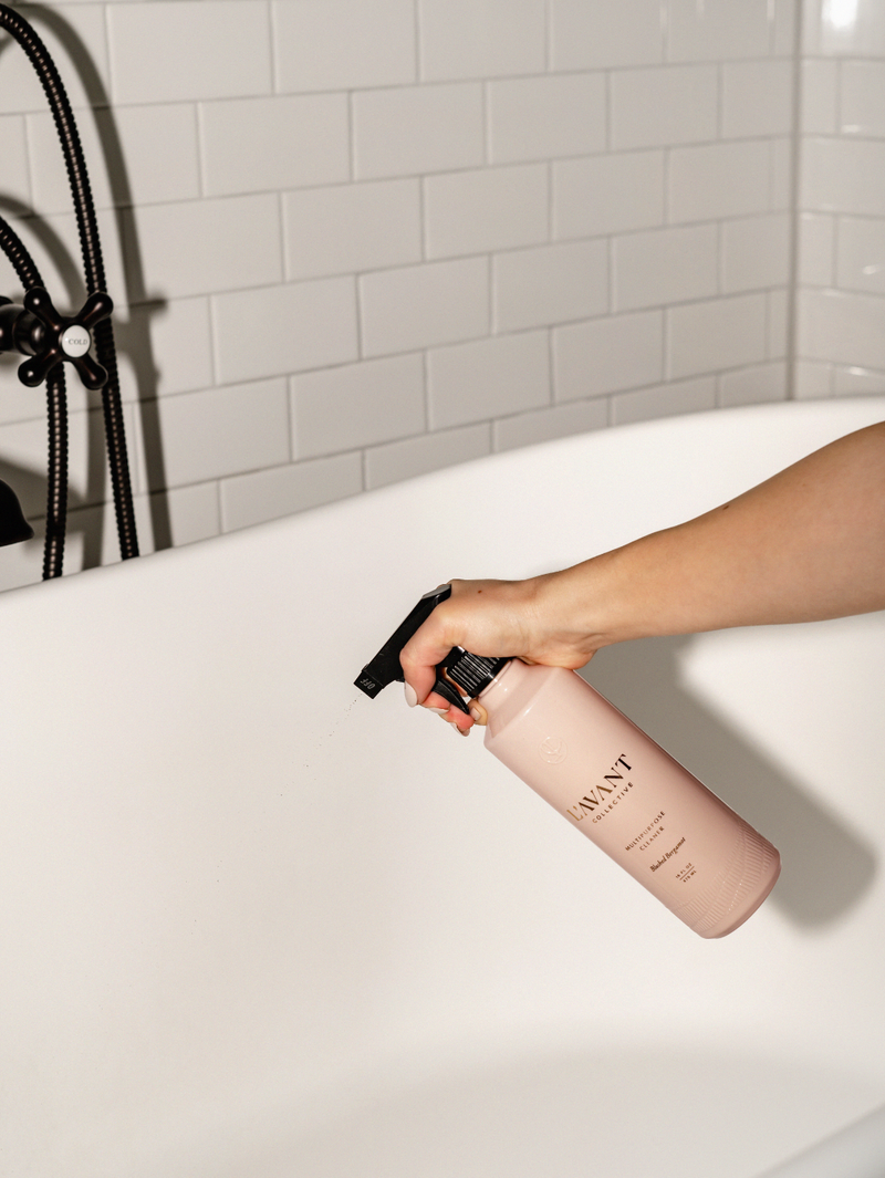 L'AVANT Collective - Multipurpose Surface Cleaner in Blushed Bergamot scent, shown being held in a hand, ideal for various surfaces.