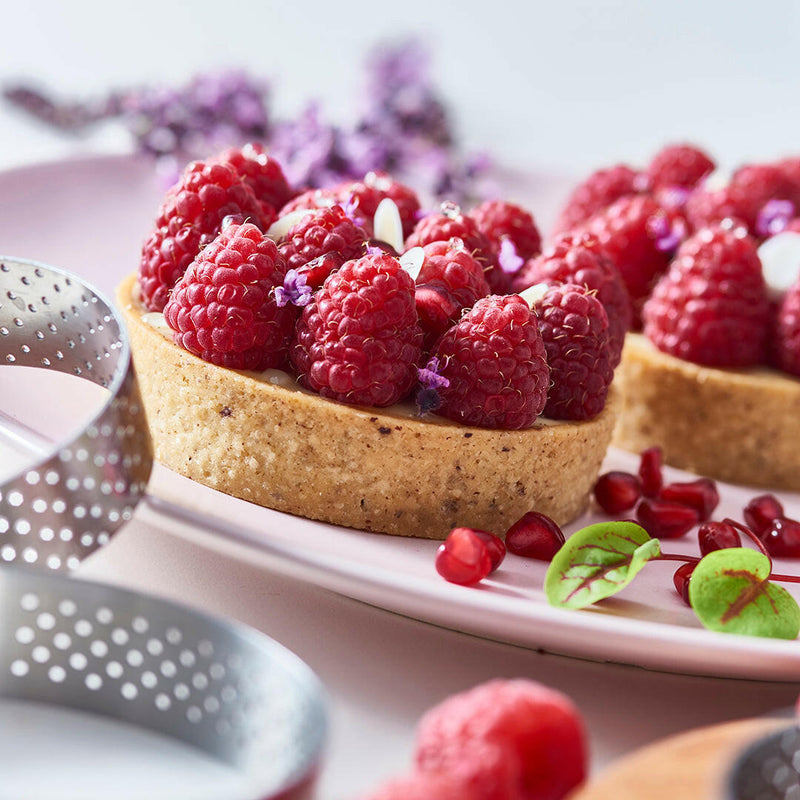 de Buyer | Perforated Tart Ring - 4, made of 18/10 stainless steel, features perforations for even baking and crisp tart crusts, ideal for home baking enthusiasts.