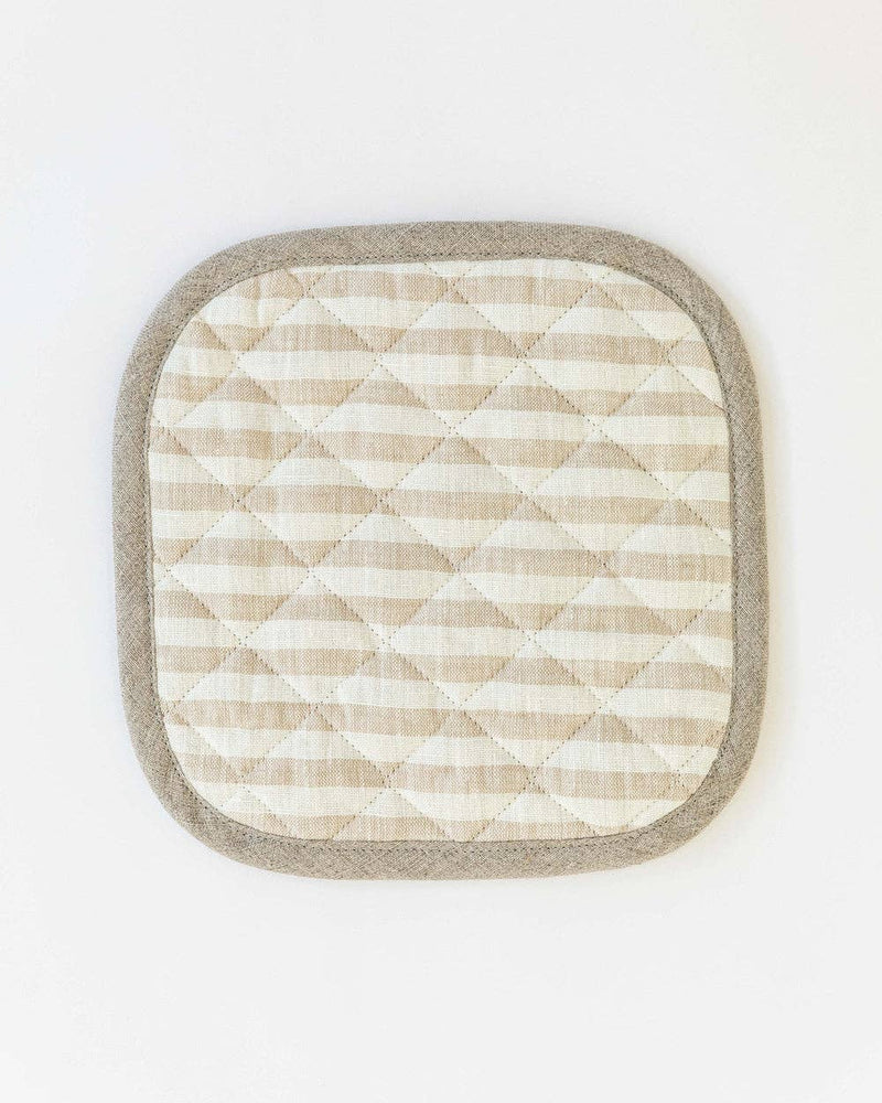 Close-up of a MagicLinen linen pot-holder with quilted detailing and a hanging loop, ideal for kitchen use, available in various colors.
