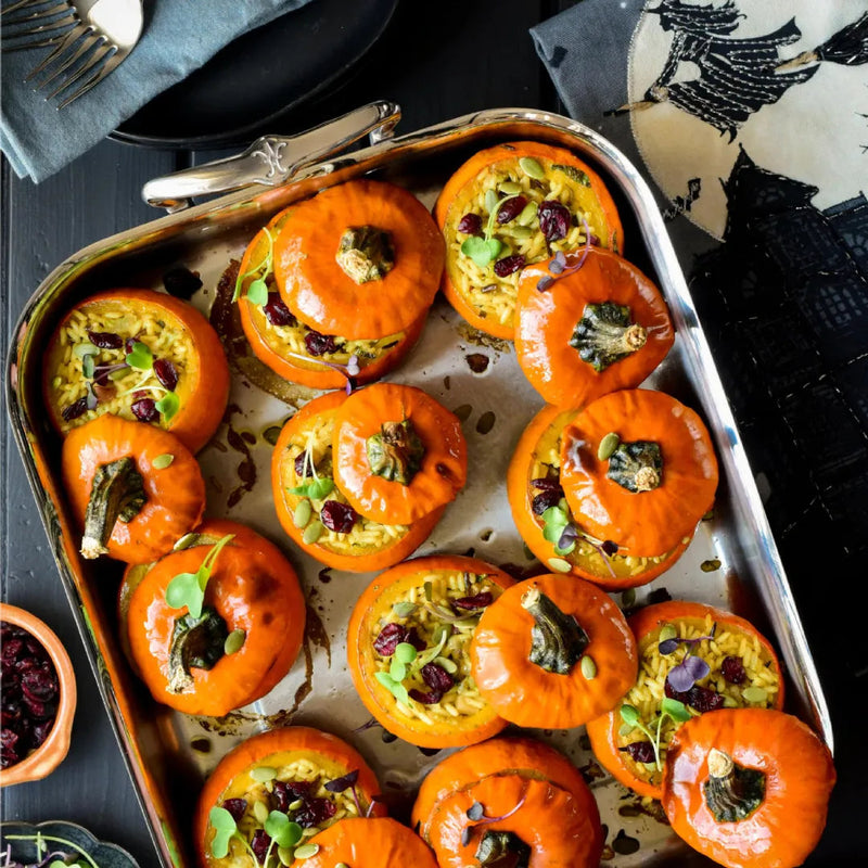 Hestan Provisions | Classic Roaster with Rack, 14.5 Inches, showcasing festive stuffed pumpkins with rice, cranberries, and seeds, perfect for holiday entertaining.
