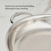 Hestan Provisions | Large Clad Oval Roaster close-up showing flush rivets on stainless steel, emphasizing easy cleaning and refined craftsmanship for chefs and home cooks.