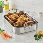 Hestan | Polished Clad Stainless Steel Roaster with Rack, Small, showcasing roasted birds and vegetables, ideal for enhancing your culinary creations with professional-grade performance.