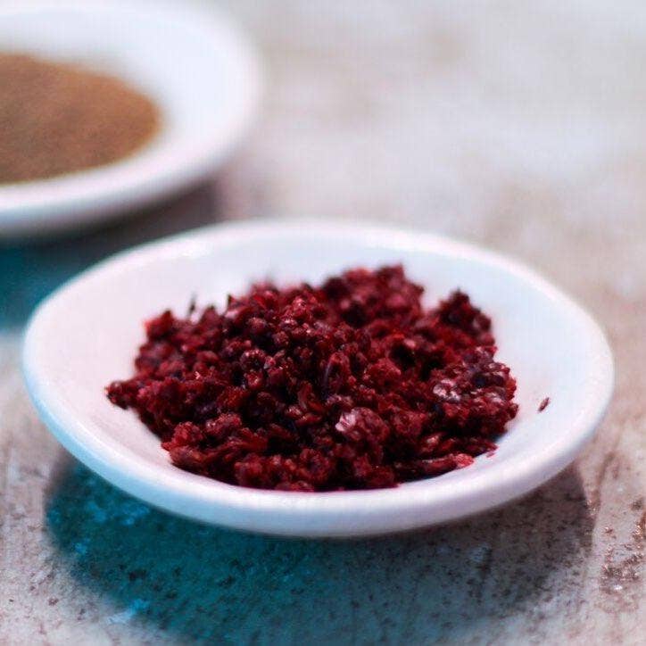 Burlap & Barrel - Cured Sumac in a 2.3 oz jar, a vibrant Middle Eastern spice ideal for enhancing salads, meats, and dips with a sour, salty flavor.