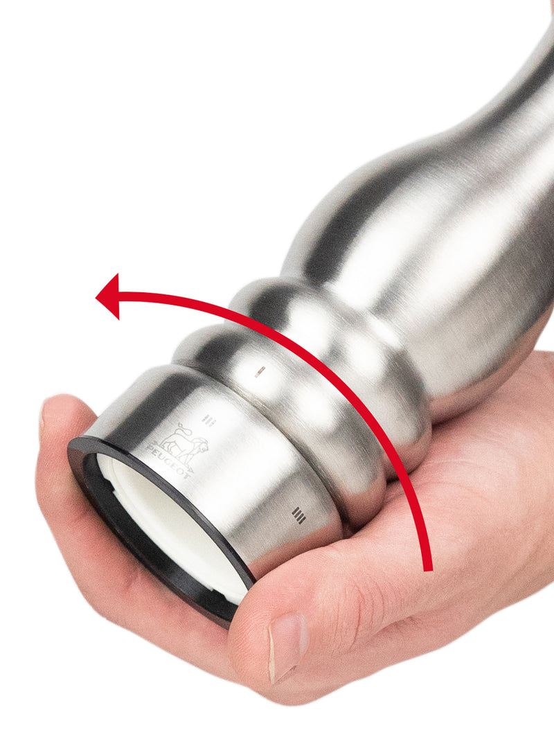 Peugeot | Paris U'Select Stainless Steel Salt Mill, 9 inches, with adjustable coarseness settings and ceramic grinding mechanism, held and twisted for seasoning.