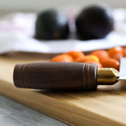 Lamson 8 Chinese Vegetable Cleaver with Walnut Handle on a cutting board, showcasing its craftsmanship and design for precision in kitchen tasks.