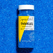 Supernatural Twinkles Sanding Sugar: Sapphire Blue in a clear bottle, labeled soy-free, artificial dye-free, made in the USA, 3 oz. Perfect for baking and decorating.