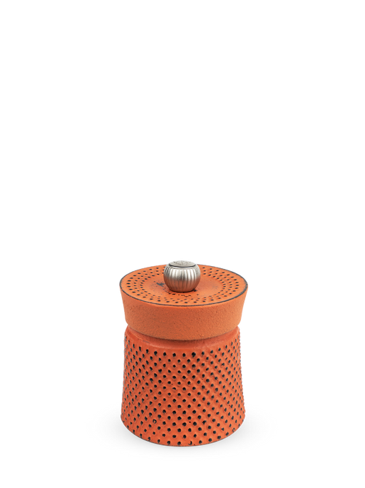 Peugeot | Bali Cast Iron Pepper Mill, Orange, with a perforated clay-and-metal design, ideal for grinding spices, inspired by traditional tea ceremonies.
