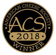 Tulip Tree Creamery - Hops: 5 Oz. Wedge, a semi-soft cheese infused with regional beer, displayed with a black and gold logo emphasizing its award-winning status.