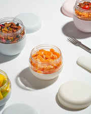 W&P Glass Seal Tight Bowl, 16 oz, features a leak-proof screw-top lid and silicone sleeve, ideal for eco-friendly food storage and transport.