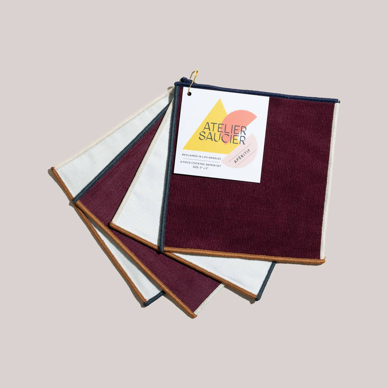 ATELIER SAUCIER - Clubhouse Cocktail Napkins | Set of 4 featuring burgundy and ivory squares with contrasting trim, expertly crafted from reclaimed fabric in Los Angeles.