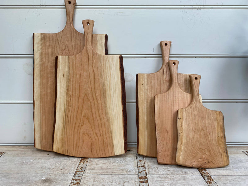 Petermans Boards and Bowls Inc. 18 Cherry Serving Board with Handle, crafted from upcycled cherry wood, showcasing elegant craftsmanship and sustainability from New England.