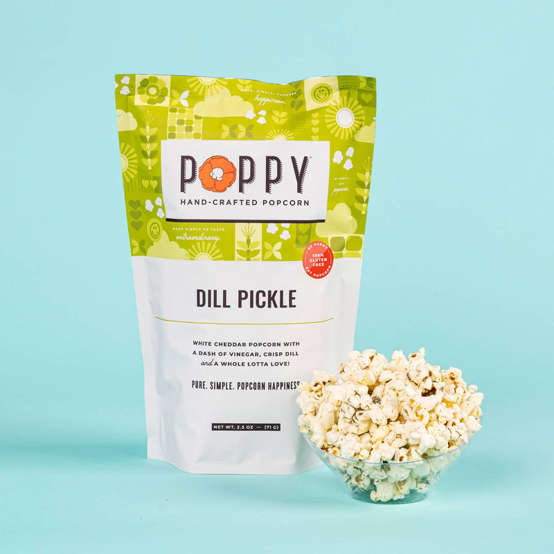Poppy Hand-Crafted Popcorn - Dill Pickle Popcorn, featuring a market bag and bowl filled with popcorn, highlighting its white cheddar, vinegar, and dill flavor.
