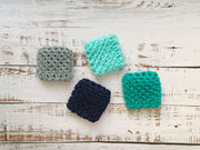Dish Scrubbies - Navy by Dot and Army; a set of four handmade durable nylon scrubbies, ideal for cleaning, shown on a white wood surface.
